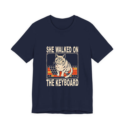 She Walked On The Keyboard tee flat front, navy unisex tee, cream screen print