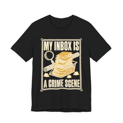 My Inbox Is A Crime Scene tee flat front, black unisex tee, an overflowing mail tray with a magnifying glass