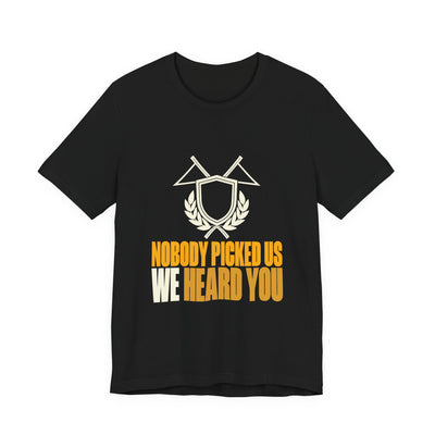 Nobody Picked Us tee flat front, black unisex tee, crossed pennants and laurel crest