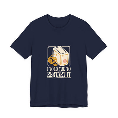 I Told You To Restart It tee flat front, navy unisex tee, cream and peach a desktop computer tower
