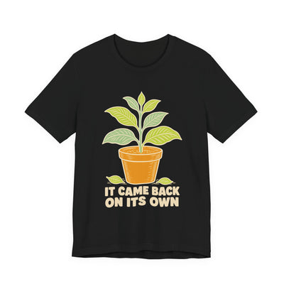 It Came Back On Its Own tee flat front, black unisex tee, potted plant with one leaf