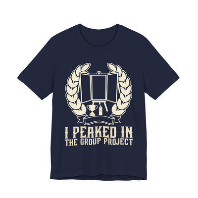 I Peaked In The Group Project tee flat front, navy unisex tee, a poster board on an easel in a laurel wreath