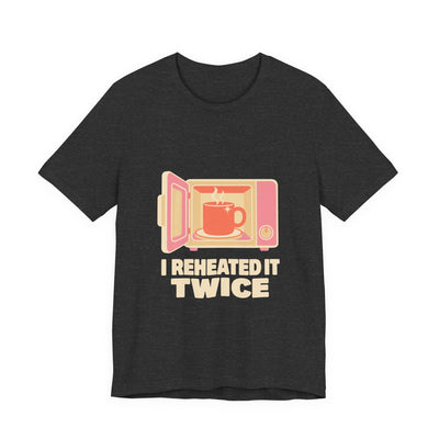 I Reheated It Twice tee flat front, dark grey heather unisex tee, cream print