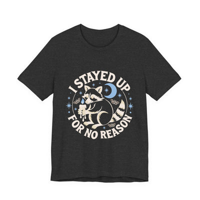 I Stayed Up For No Reason tee flat front, dark grey heather unisex tee, a raccoon holding a candle stub