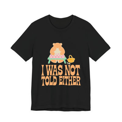 I Was Not Told Either tee flat front, black unisex tee, bear at an empty picnic table