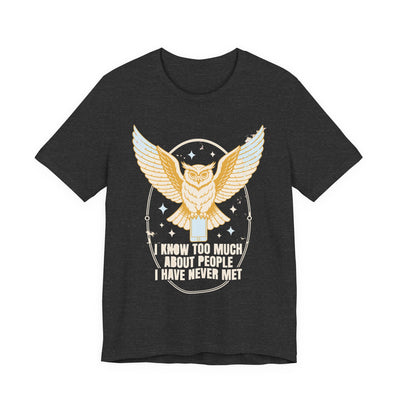 I Know Too Much About People tee flat front, dark grey heather unisex tee, an owl perched on a phone