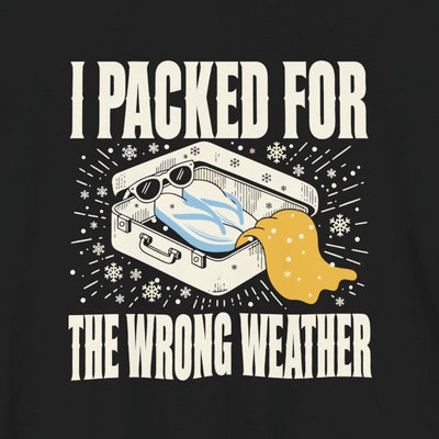 I Packed For The Wrong Weather tee print close-up, black unisex tee, suitcase of beach gear in snow