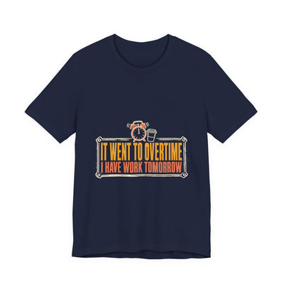 It Went To Overtime tee flat front, navy unisex tee, a ringing alarm clock beside a coffee cup