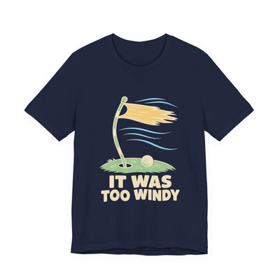 It Was Too Windy tee flat front, navy unisex tee, golf flag bent in the wind