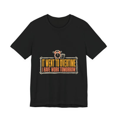 It Went To Overtime tee flat front, black unisex tee, a ringing alarm clock beside a coffee cup