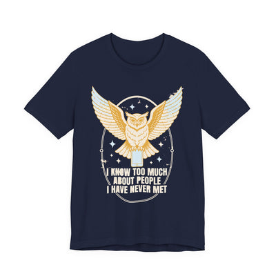 I Know Too Much About People tee flat front, navy unisex tee, an owl with wings spread perched on a phone