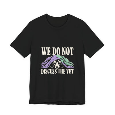 We Do Not Discuss The Vet tee flat front, black unisex tee, dog hiding under a blanket