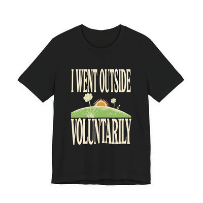 I Went Outside Voluntarily tee flat front, black unisex tee, sun over a green hill