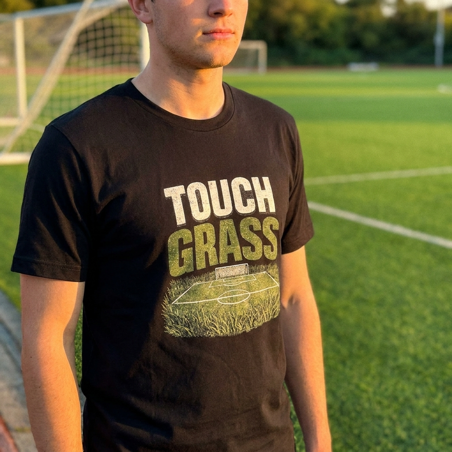 Touch Grass funny soccer meme tee worn on a soccer pitch