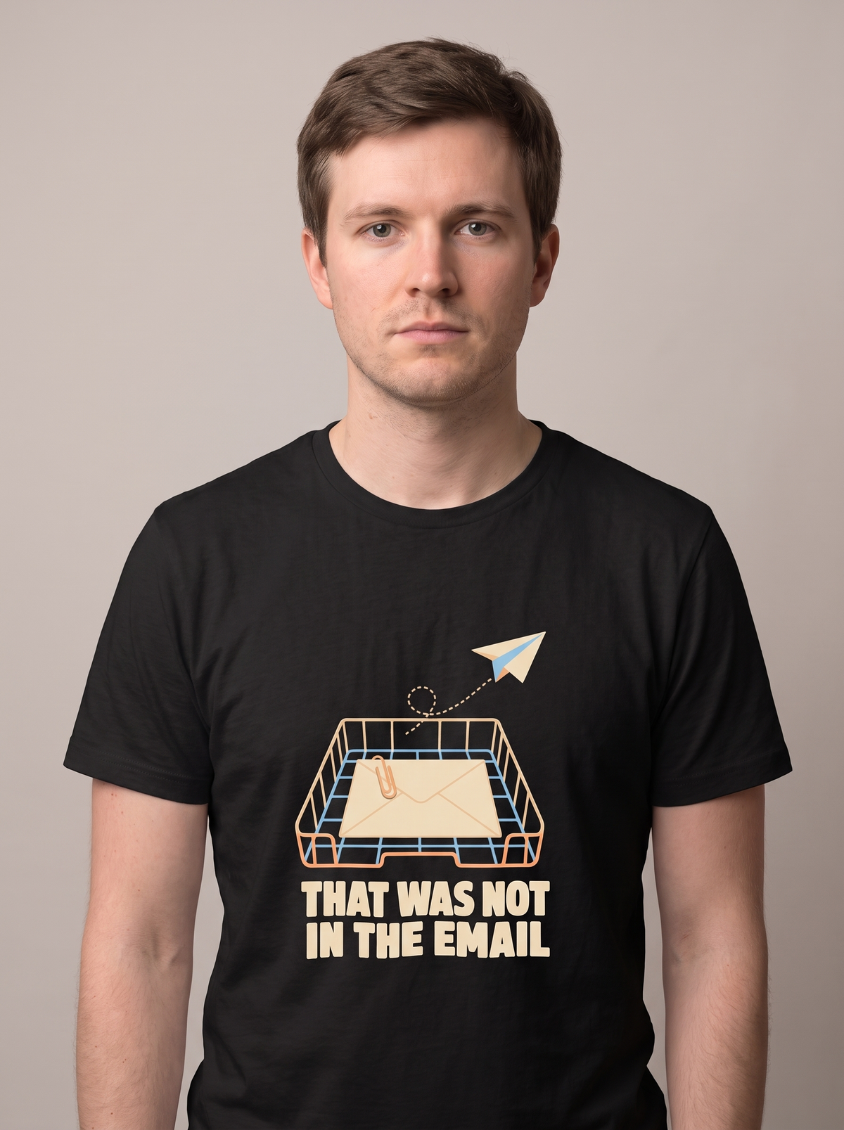 That Was Not In The Email tee worn front view, black unisex tee, paper plane leaving an inbox tray