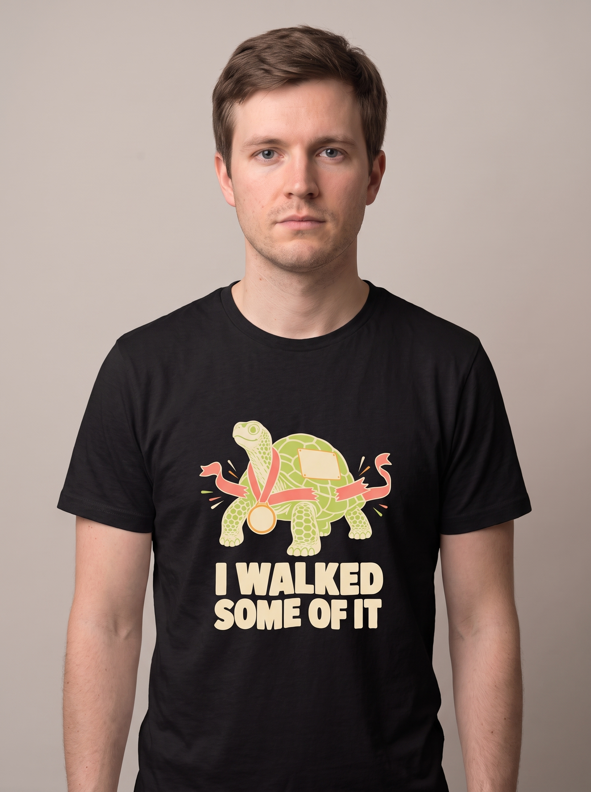 I Walked Some Of It tee worn front view, black unisex tee, tortoise in a race bib and medal