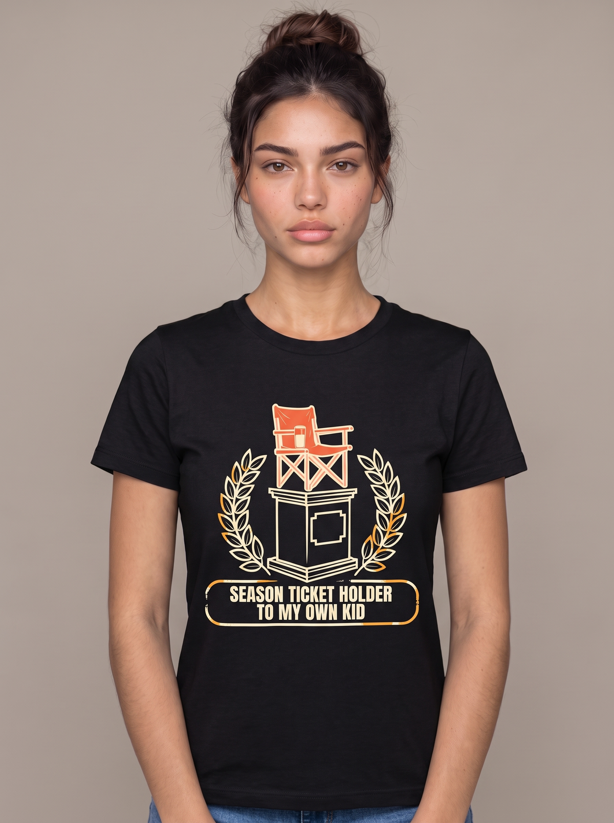 Season Ticket Holder To My Own Kid tee worn front view, black unisex tee, camp chair on a trophy plinth