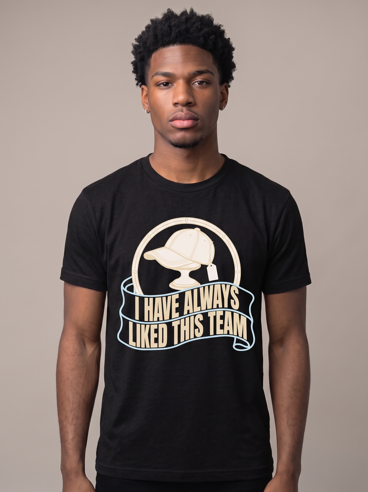 I Have Always Liked This Team tee worn front view, black unisex tee, a new ball cap with the tag still attached