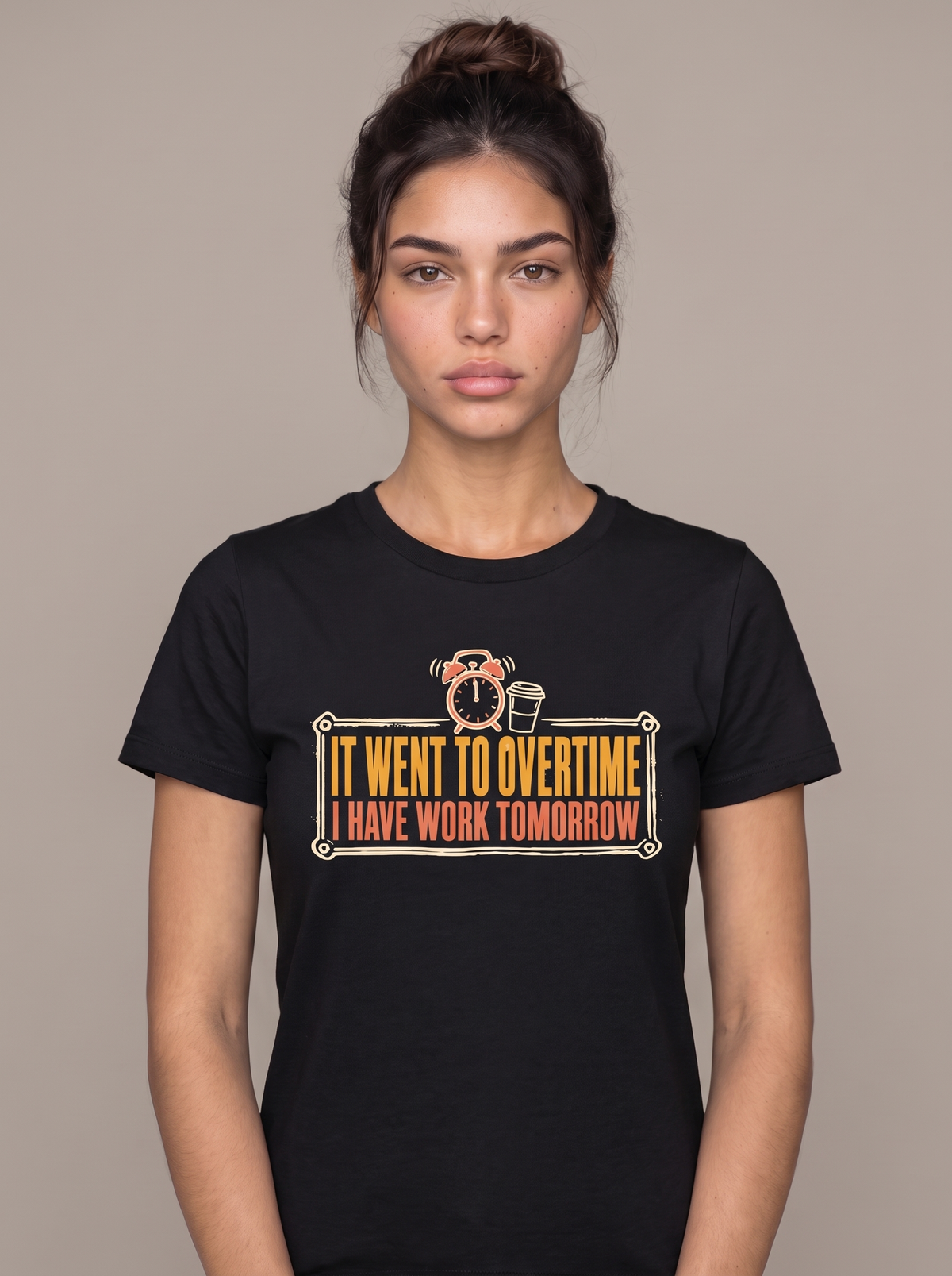It Went To Overtime tee worn front view, black unisex tee, a ringing alarm clock beside a coffee cup