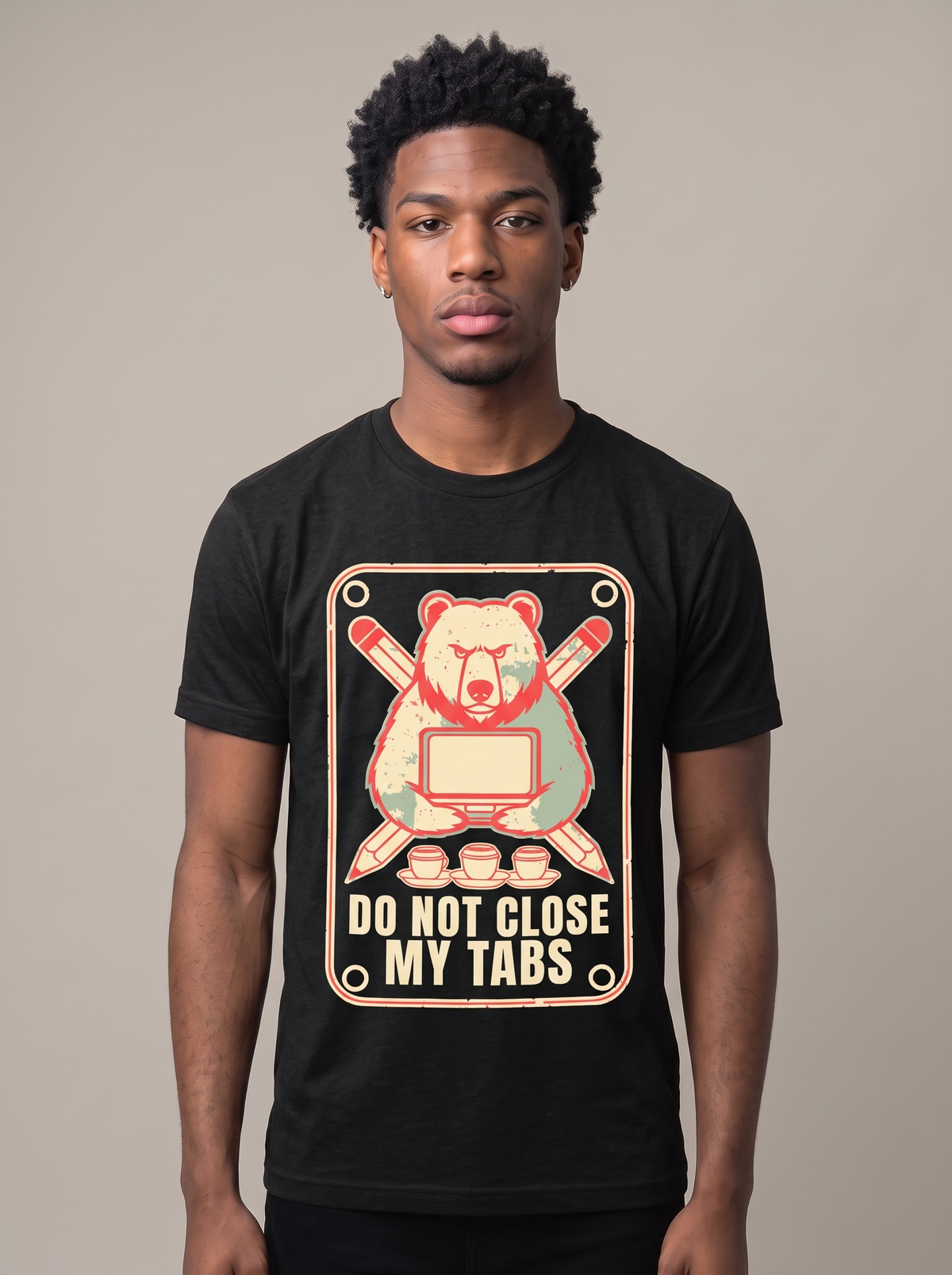 Do Not Close My Tabs tee worn front view, black unisex tee, a bear guarding a laptop with pencils crossed behind