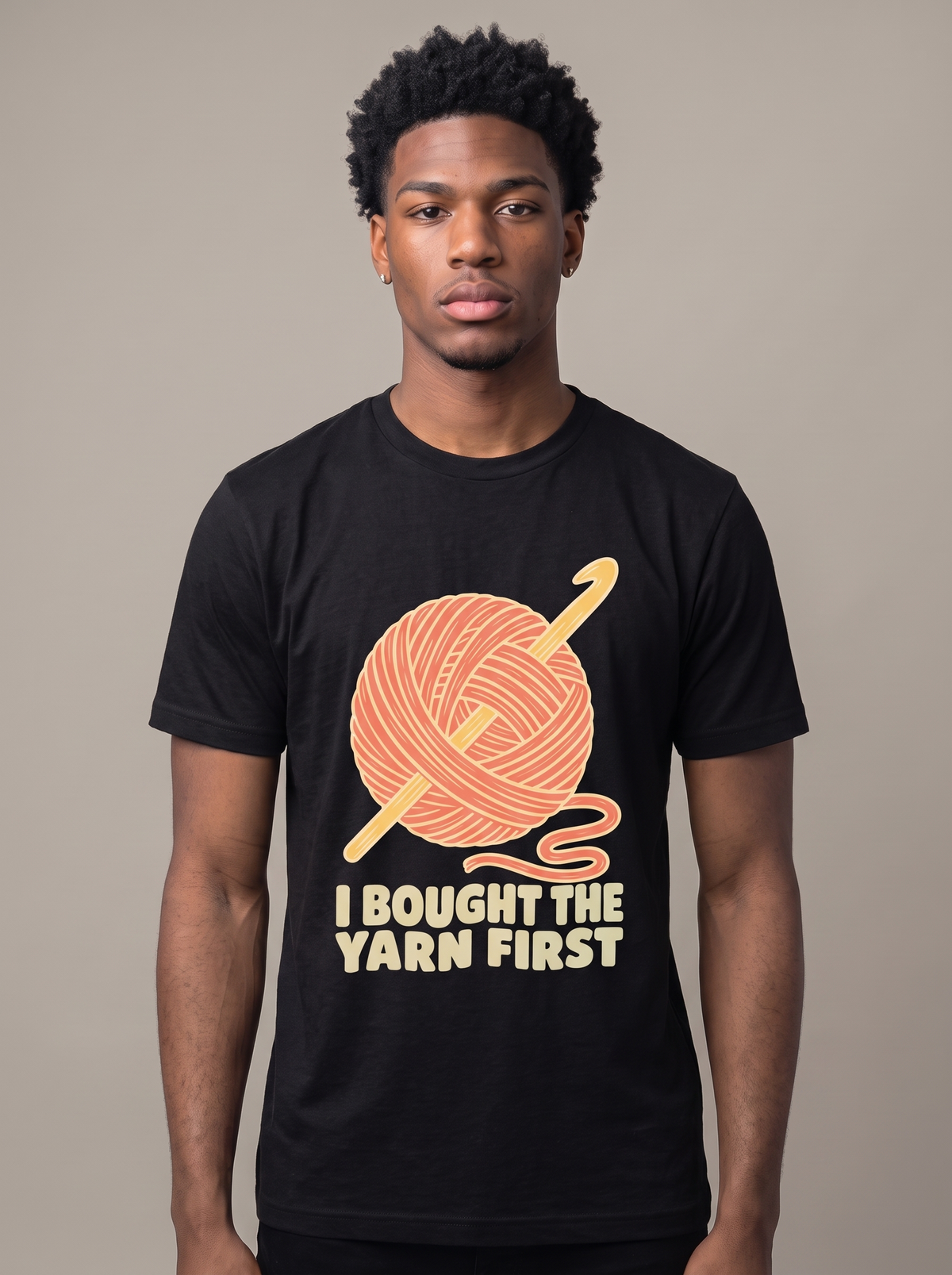 I Bought The Yarn First tee worn front view, black unisex tee, ball of yarn and crochet hook