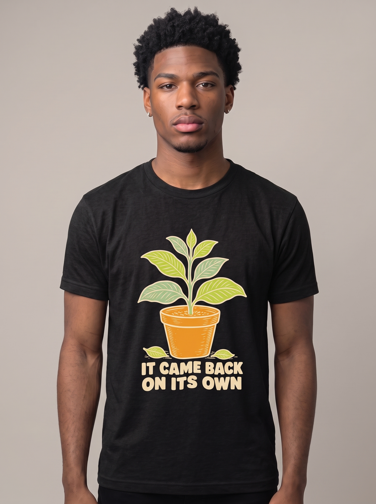 It Came Back On Its Own tee worn front view, black unisex tee, potted plant with one leaf