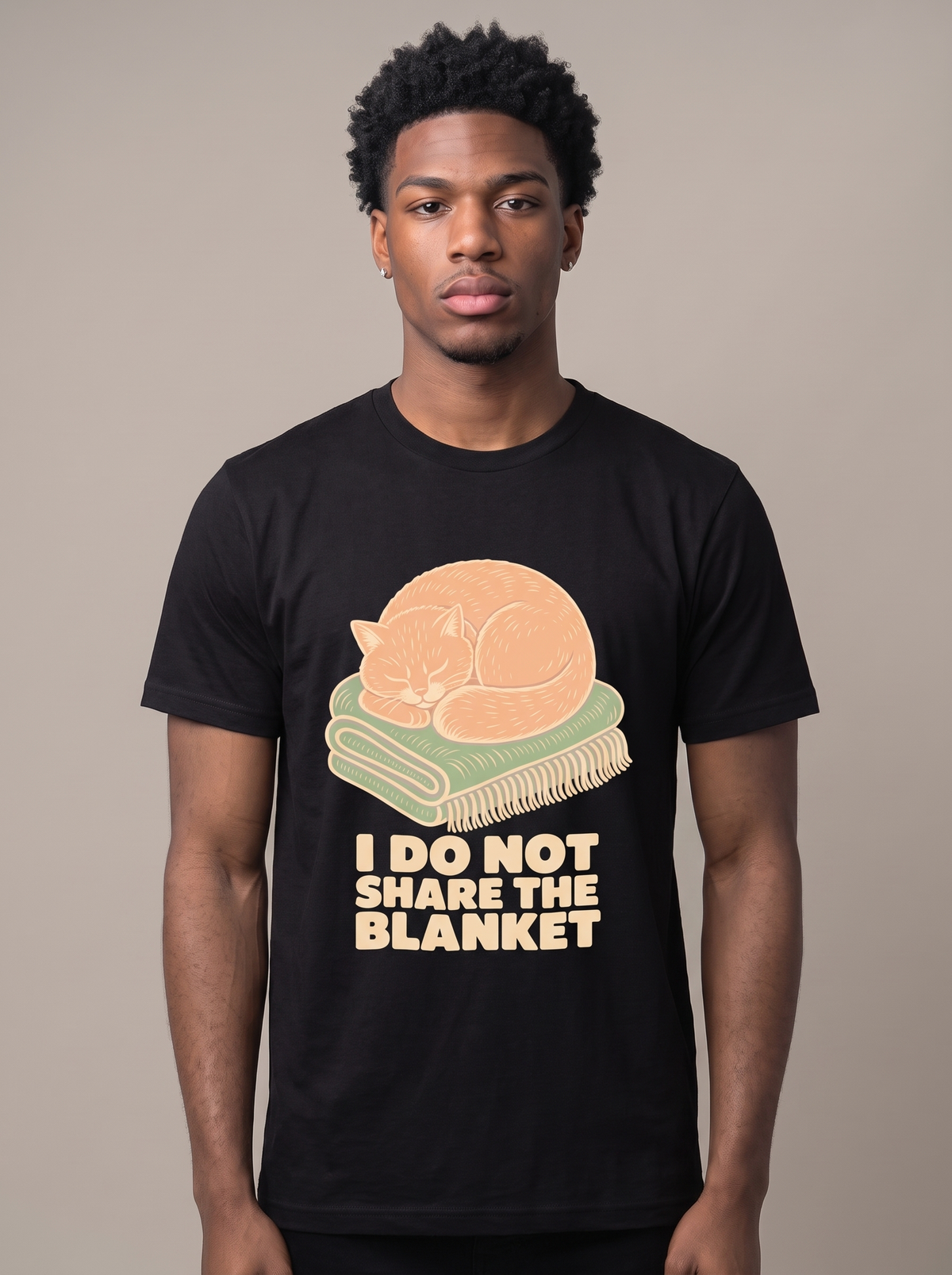I Do Not Share The Blanket tee worn front view, black unisex tee, cat asleep on a blanket