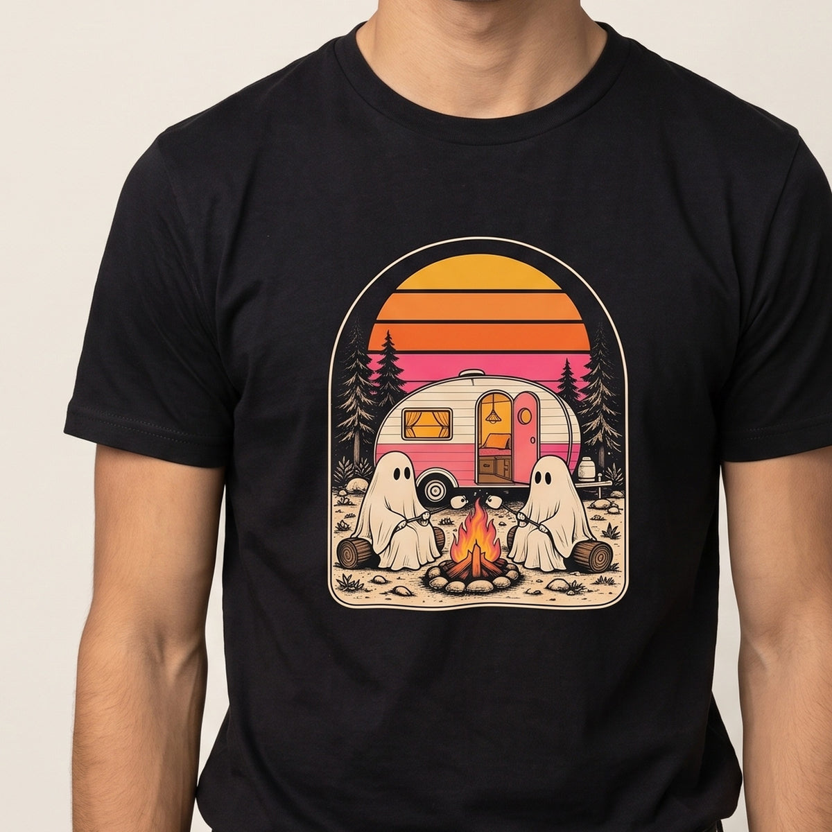 Ghost Campfire tee worn front view, black unisex tee, two sheet ghosts at a campfire by a vintage camper